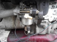 Briggs 15 HP Lawn Mower Engine Issue: Excess Fuel Spilling from Spark Plugs & Valve Cover